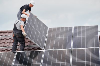 Technician Mounting Solar Panels